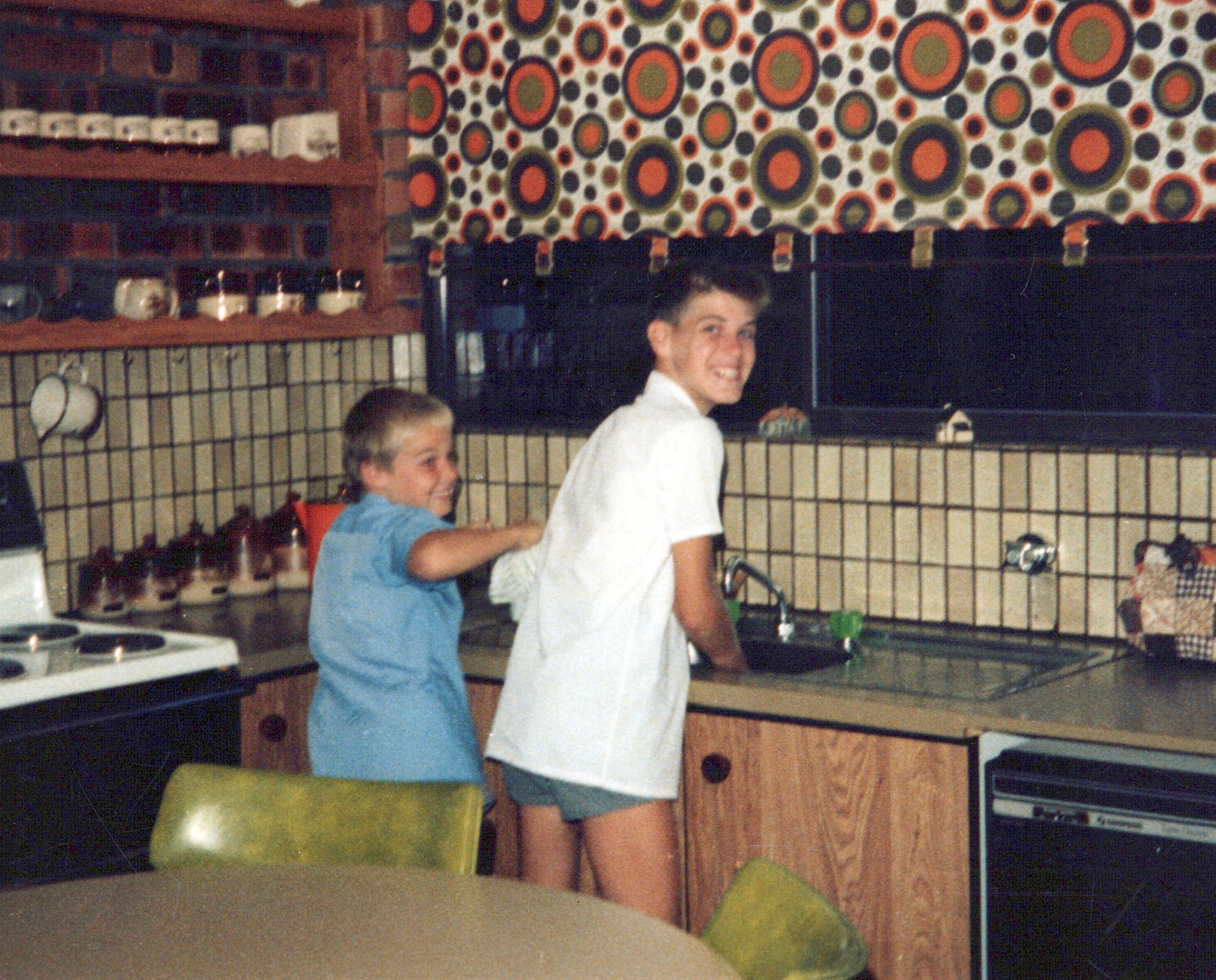 Mark & Karl - Taken November, 1986. Pretending to "wash up" but the dishwasher next to them gives them away!