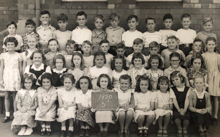 Grade 3, Wickham Primary School (1950) Back row from left to right: John Elbourne, Kelly Nickelborough, Winston Loads, Doug Nye, Ronny Maguire, Alan Starling, Ron Casey, Barry Baldock, John Fordham, Trevor Clarke, Win Renshaw, Allen Russell. 3rd row from left: Faye gardener, unknown, unknown, unknown, Kevin Robbs, Gary Mace, Ronny Parrot, Ron Phillips, Dennis Kibble, Bruce Woods, Jimmy Hayden, unknown. Second row: unknown, unknown, Sheila Wilson, unknown, unknown, Gloria Dymock, Janice Peterson, Norma Flanagan, Merlene Lawrence. Front row, unknown, unknown, unknown, unknown, Anne Allanis (holding the sign), unknown, unknown, Jenny McKennie, Jan Frewin, unknown. Apologies for the omissions. 