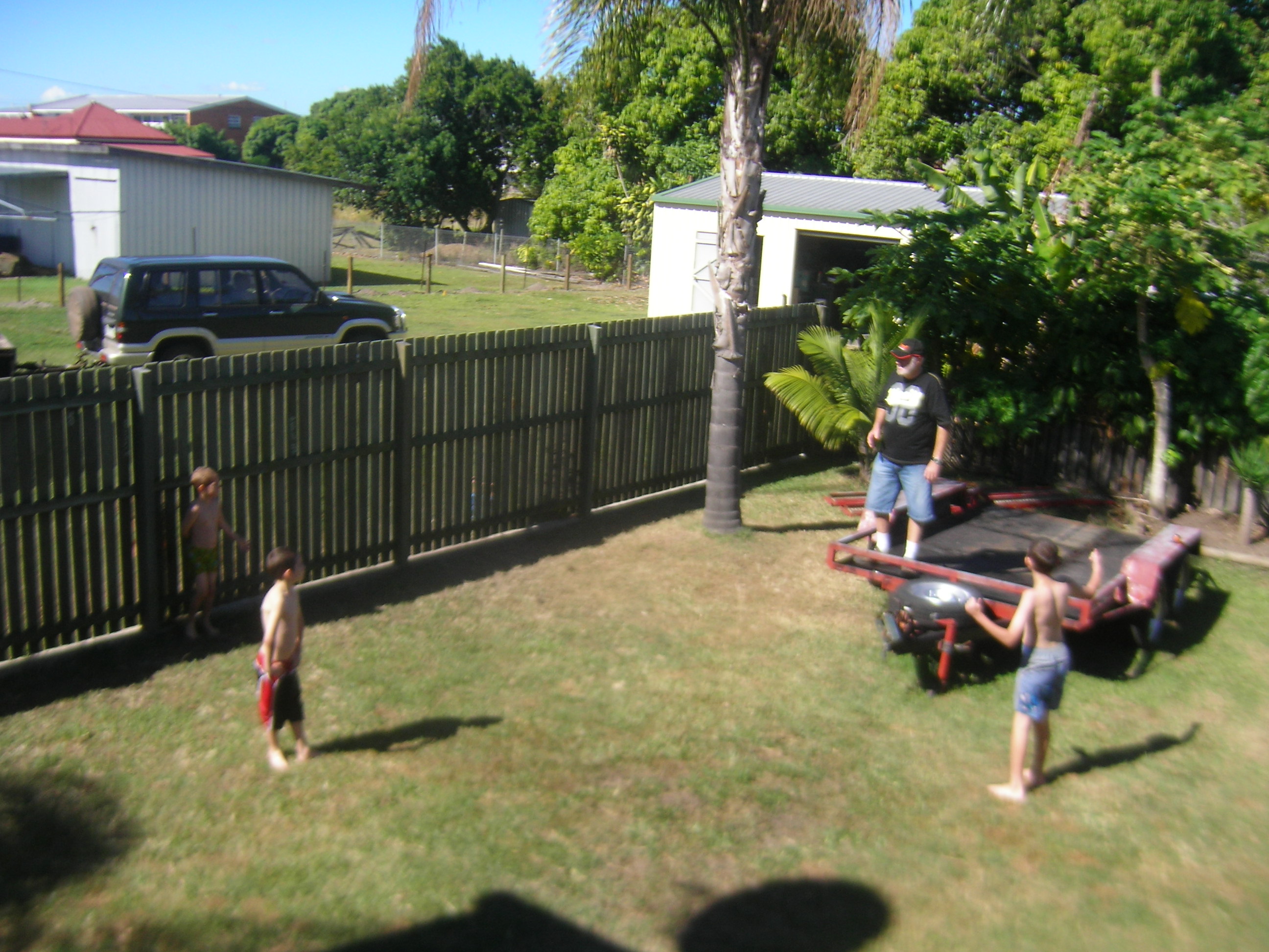 Reg and the boys playing in the yard