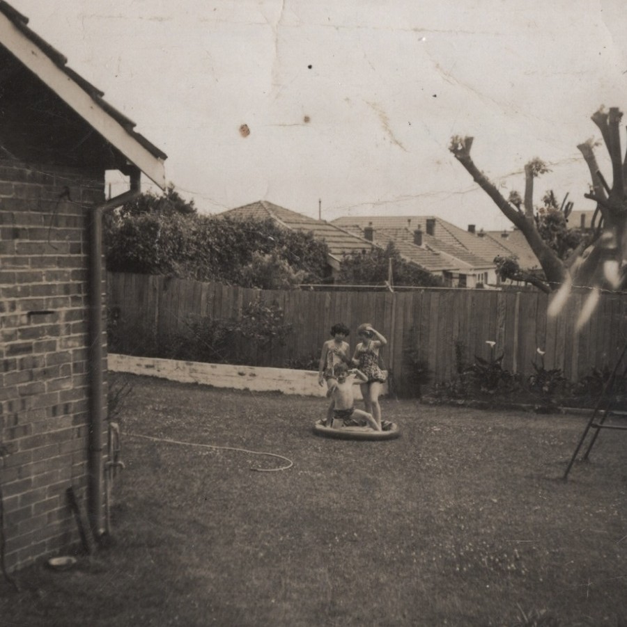 Cheryl, Geoff and a neighbourhood friend (left) playing in the backyard at 270 Maroubra Road